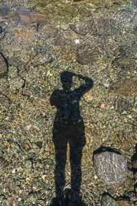 Shadow of man on rock