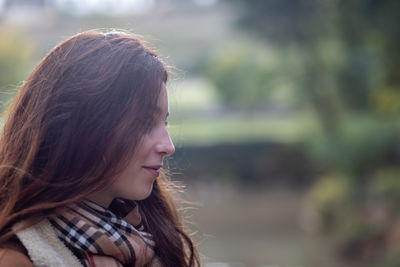 Portrait of smiling young woman outdoors