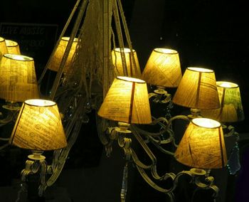 Illuminated lamp post at night