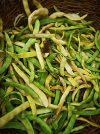 High angle view of green chili peppers in market