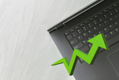 High angle view of laptop and text on table