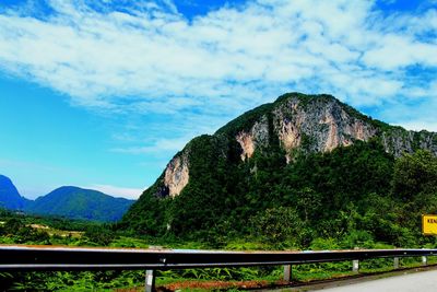 Scenic view of mountains against blue sky