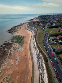 High angle view of road by sea against sky