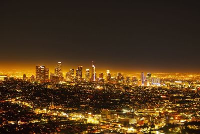 Illuminated buildings in city at night