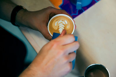 Close-up of man hand holding drink