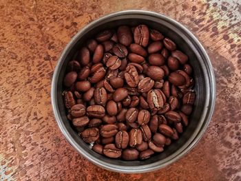 High angle view of coffee beans in bowl on table