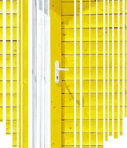 Close-up of yellow door of building