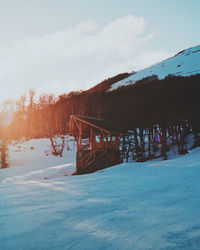 Scenic view of snow covered landscape against sky