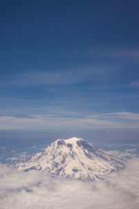 Aerial view of snowcapped mountains against sky