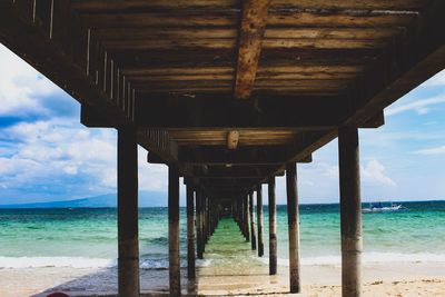 Pier over sea against sky