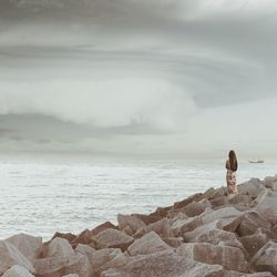 Scenic view of sea against cloudy sky