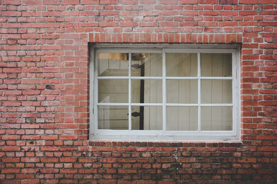 Window on brick wall of building