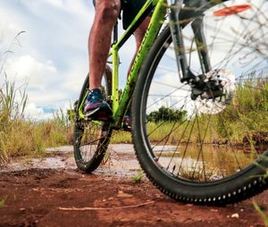 Low section of person riding bicycle