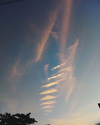 Low angle view of silhouette trees against sky at sunset