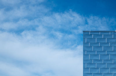 Low angle view of building against blue sky