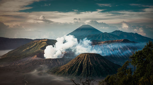 Smoke emitting from volcanic mountain