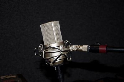 Close-up of telephone booth against black background