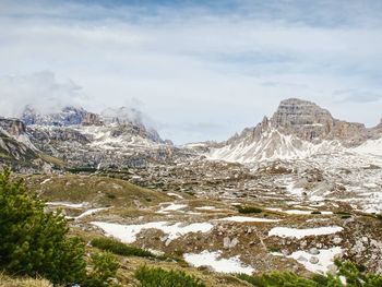 Sharp alps peaks rocks without people. view over alpine rocks above deep vallyes to far horizon