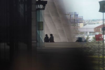 Woman standing in front of building