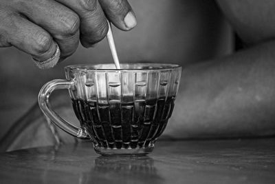 Close-up of hand holding coffee cup