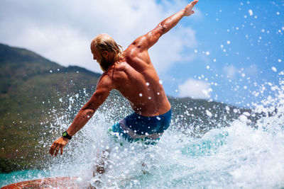 Man surfing on sea