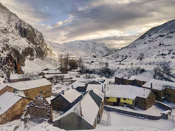 Scenic view of snowcapped mountains against sky during winter