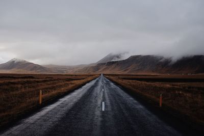 Road amidst landscape against sky