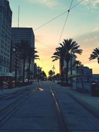 View of city street at sunset