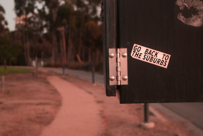 Close-up of information sign on road