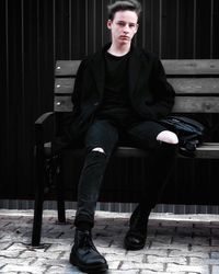 Portrait of young man sitting on seat