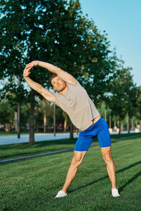 Full length of man climbing on grass