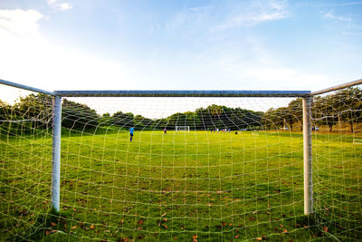 Scenic view of soccer field against sky