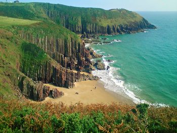 Panoramic view of sea and mountains against sky