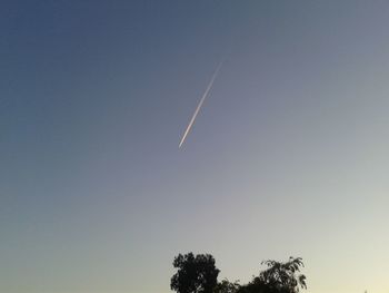 Low angle view of vapor trail against clear sky