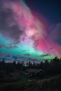 Scenic view of landscape against sky at night