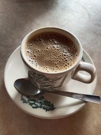 High angle view of coffee cup on table