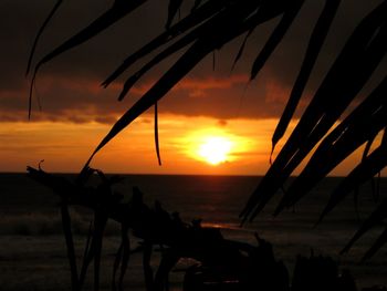 Scenic view of sea against orange sky