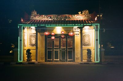 Illuminated entrance of building at night