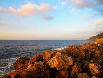 Scenic view of sea against sky at sunset