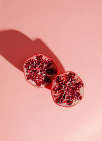 Close-up of red berries against white background