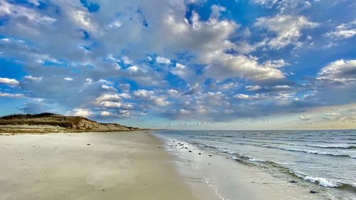 Scenic view of beach against sky