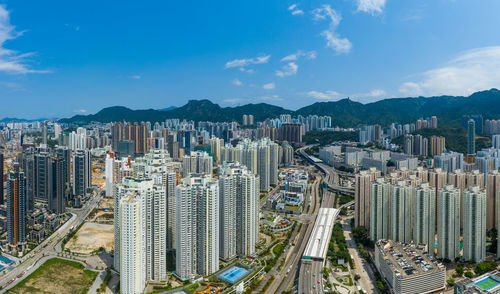 High angle view of buildings in city against sky