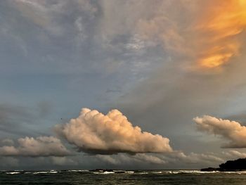 Scenic view of sea against storm clouds