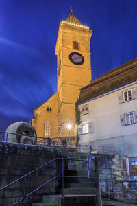 Low angle view of clock tower against sky