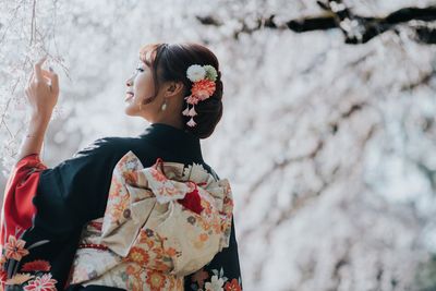 Woman holding flower bouquet