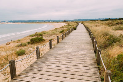 Pier over sea against sky