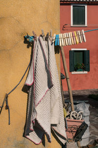 Clothes drying against wall