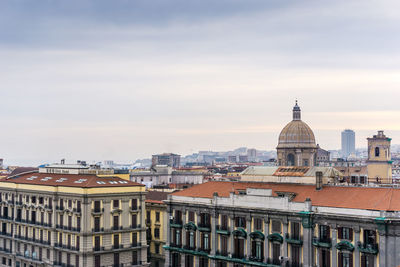 Buildings in city against sky