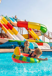 High angle view of boy swimming in pool