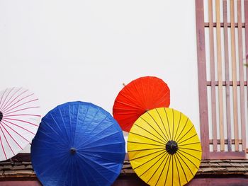 Multi colored umbrella against sky